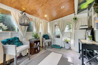 The enclosed outdoor patio is a wonderful retreat. The door on the right goes out to the hot tub courtyard, you are going to love it.