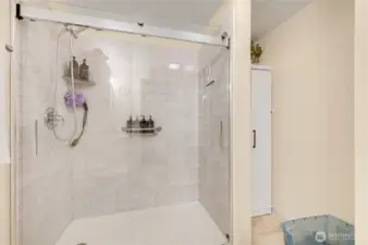 The big, beautiful shower, with additional storage on the right.