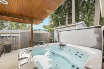 A great view of the hot tub courtyard with additional storage shed. What a cool secluded retreat!