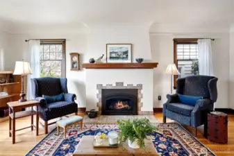Gas fireplace with original tile surround.
