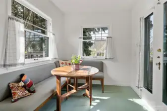 fantastic nook area just off the kitchen - double doors lead to patio.
