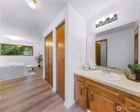 Open access to the sink and vanity in the primary bedroom.