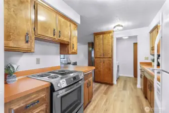 Galley kitchen with lots of storage and some unique 70s custom details.