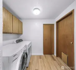 Laundry room with newer washer and dryer.