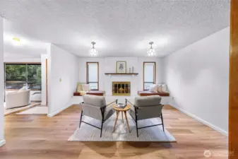 Amazingly cozy secondary living room with wood burning fireplace and built in bench seats.