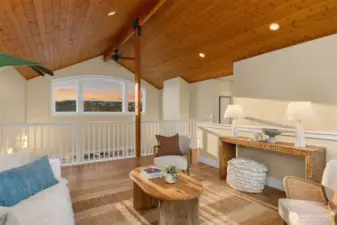 Featuring a tongue and groove ceiling and expansive picture windows.