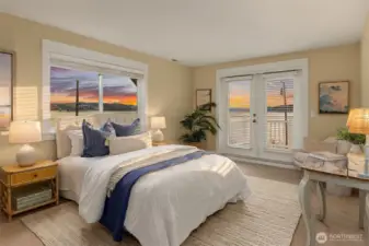 The second bedroom upstairs is ensuite and has a sweet balcony to taking in the salt air.