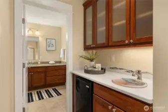 Around the corner from the loft is a beverage center with sink and mini-fridge.