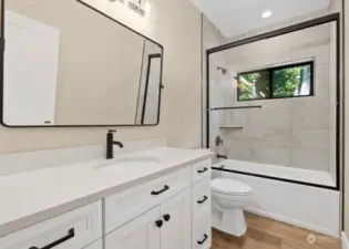 This is the full bath for bedrooms 2 & 3.  Nothing spare with this bath either.  Gorgeous tile work, beautiful vanity, HUGE mirror and high end hardware