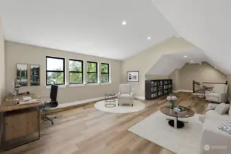 Virtually Staged. This is is just one way of using the bonus room/ Flex room above the garage.  Cathedral ceilings, HUGE windows make it a light and bright, open space.  Pick your use and make it yours.