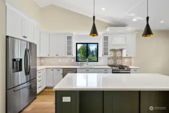 Truly a perfect kitchen, open, spacious, lots of cabinetry and counter space. A true delight to cook in.