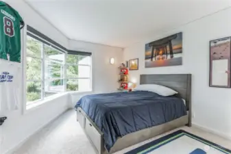 Upstairs bedroom with large windows