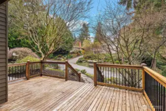 The deck wraps all the way around to join up with a meandering garden pathway in the front.