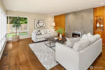 Gather around the granite-surround gas fireplace with lighted display area.