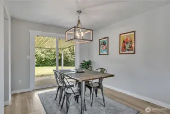 Dining Room with slider adjoins to patio and level backyard