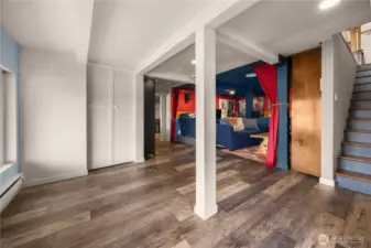 Lower level, stairs leading to basement. Shown in the photo is a utility closet.