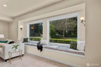 Large window and sitting area is a  great spot to unwind while reading a book, enjoying a cup of coffee.