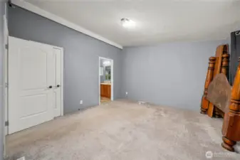 Primary bedroom includes 2 closets, one walk-in with shelves and light