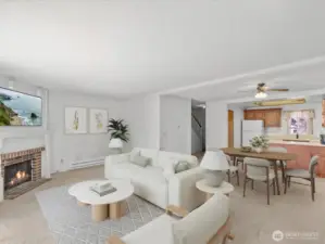 The open-concept living and dining area is anchored by a cozy corner fireplace—perfect for curling up on cool Pacific Northwest evenings.