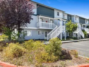 The well-maintained community offers dedicated parking and is conveniently located near shops, restaurants, schools, and commuter routes.
