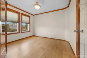 Den with double glass doors offers a quiet retreat.