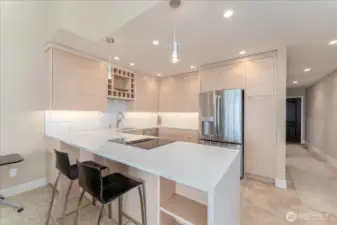 Kitchen updated with eating space for 2-3 bar stools (bar stools stay with the sale), plenty of storage spaces in the kitchen area with pantry room.  All new appliances, countertops with waterfall effect, clean colors and lines.