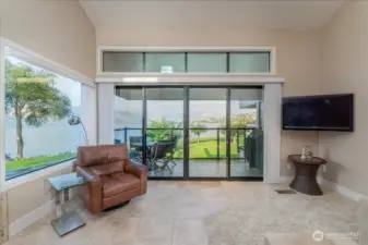 A lot of windows to help bring the outside in!   Patio is the full length of the unit.  Nice size for a table of four and your BBQ