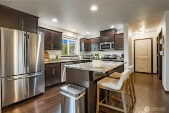 Granite countertops & stainless steel appliances complete this kitchen! Island-seating, a bonus!