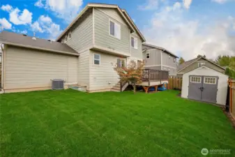 Fully fenced, new sod + sprinklers, shed for extra storage, & not pictured is a fenced-in dog run!