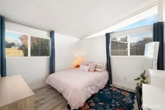 Northeast facing bedroom windows look onto the fully fenced backyard.