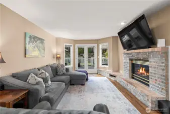 French doors continue the living space outdoors to beautiful Trex decking and concrete paver patio