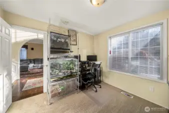 4th bedroom on main floor, currently used as an office. Bedroom, office, gym you name it!