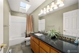 Full size hall bathroom with expansive counterspace