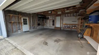 Third garage space through that door.