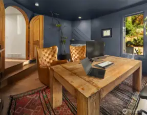 Dramatic den with arched double doors