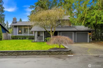Lush landscaping frames the home beautifully.