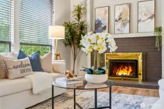 Cozy fireplace anchors the space beautifully.