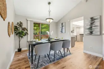 Open dining area with slider to deck, perfect for morning coffee.