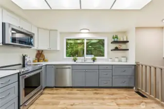 Custom colored cabinetry adds warmth and style.