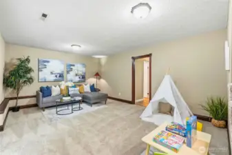 Spacious retreat for movies or game nights. Flexible layout for play, media, or hobbies.