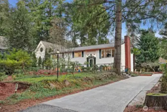 Set back from the road, the setting feels both peaceful and private.