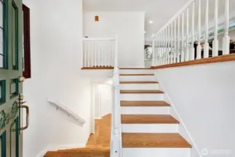 Lovely hardwood stairs lead the way up to the main level.
