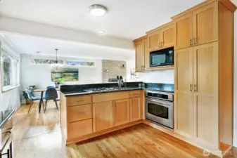 Social layout with an outward-facing cooktop so the chef can mingle.