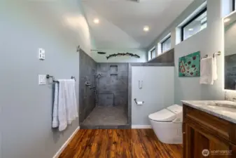 Large primary bath with updated flooring + timeless tile.