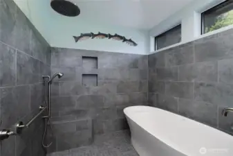 Meticulously remodeled primary shower with soaking rub