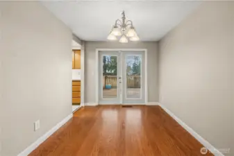 Dining room has French doors to the large back deck.