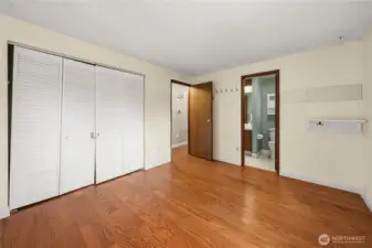 Showing the wall of closets and its own door into the hall bathroom - jack-n-jill style.