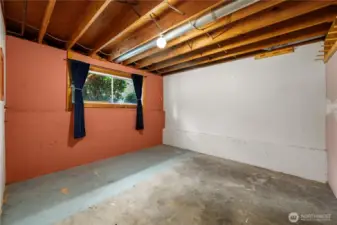 Lower level offers this bonus space, which would make a great office or hobby room.