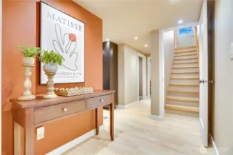 The lower level offers a versatile studio layout with its own kitchenette, laundry, and three-quarter bath—well suited for extended living, guests, or income-producing potential, previously rented as an apartment for $1,400/month.