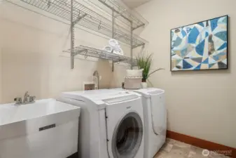Upstairs laundry with utility sink